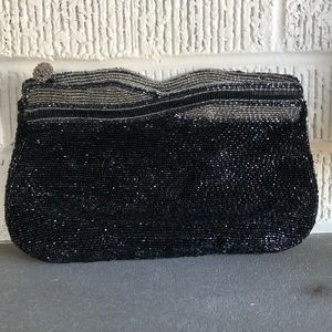 Gorgeous vintage beaded clutch purse in black/ grey/ champagne. 9” long.